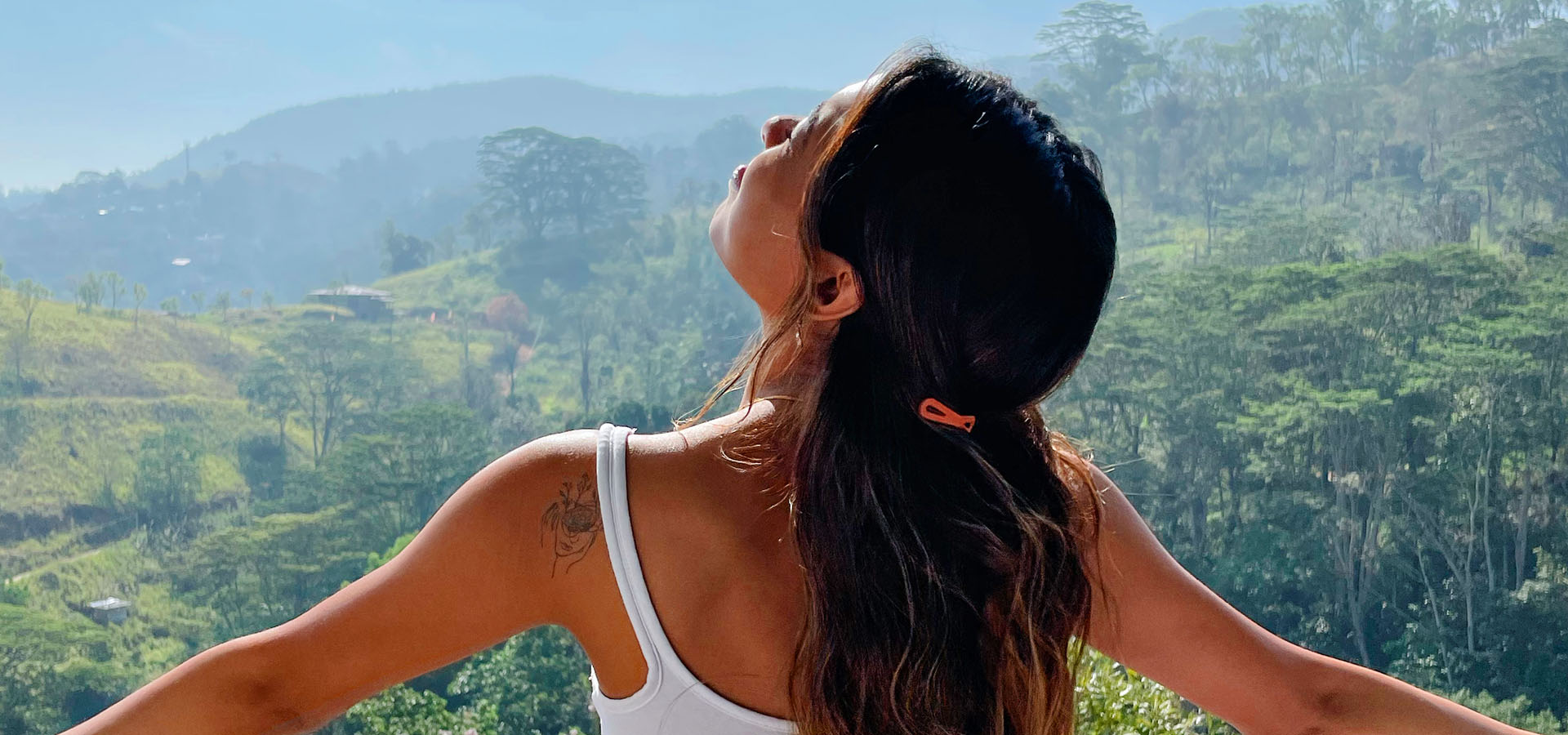 Person enjoying scenic misty hill view at Fox Kandy resort Sri Lanka