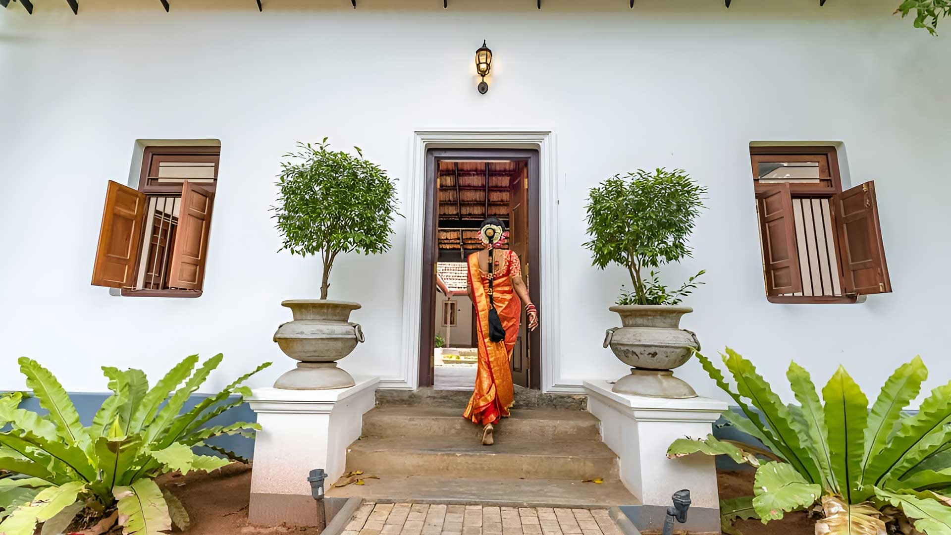 Person entering Shalom Villa near Marari Beach in Kerala India